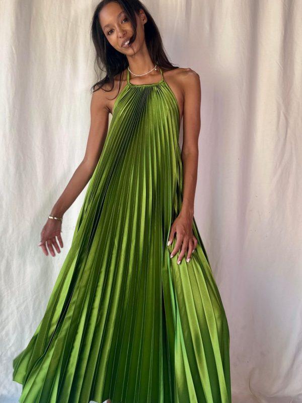 model wearing a green pleated halter maxi dress