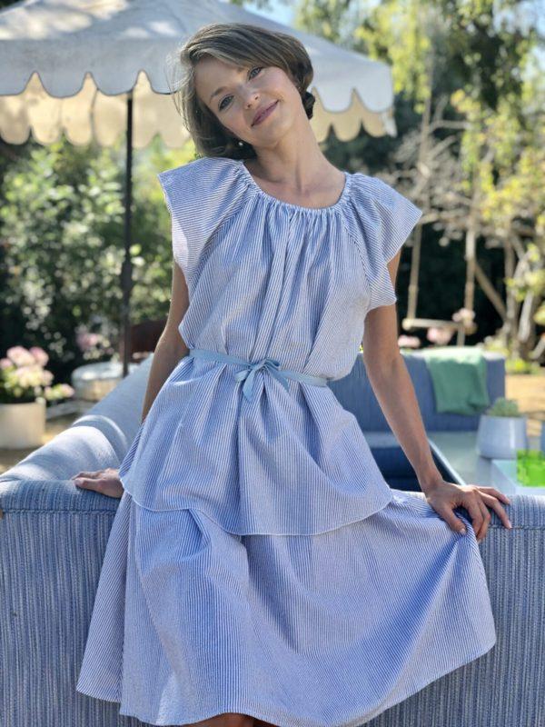 model wearing a matching top and skirt set