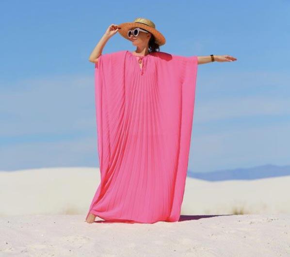 model wearing a pink caftan
